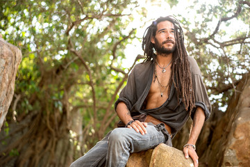 handsome guy with dreadlocks on an island in thailand