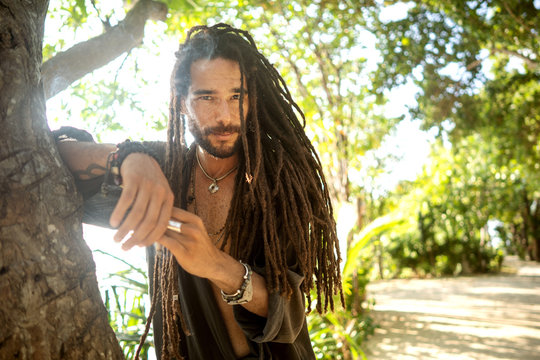 handsome guy with dreadlocks on an island in thailand