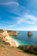 Fototapeta na wymiar high cliffs on the shore of the Atlantic Ocean. Portugal. Algarve.