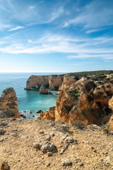 high cliffs on the shore of the Atlantic Ocean. Portugal. Algarve.