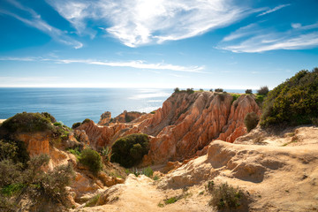 high cliffs on the shore of the Atlantic Ocean. Portugal. Algarve.