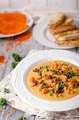 Carrot lentils cream with bacon