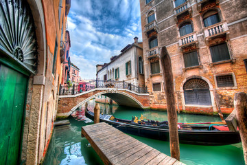 Gondola Moored in a Canal in Venice