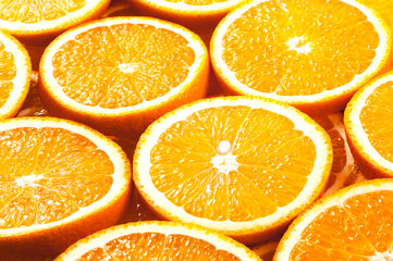 Background from fresh orange slices. Side view.