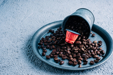 Organic coffee capsule with coffee beans on colorful background. Color contrast. copy space