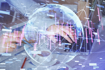 Fototapeta na wymiar Forex graph with businessman working on computer in office on background. Concept of hardworking. Multi exposure.