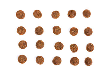 Dry cat food isolated on white background close-up top view