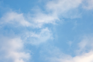 texture of the sky clouds and rays of sun on a background