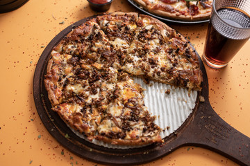 Mushroom and meat pizza without one slice