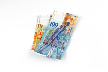 Obraz na płótnie Canvas Swiss Franc banknotes isolated on white background