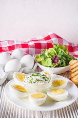 boiled chicken eggs on a white wooden rustic background
