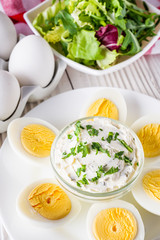 boiled chicken eggs on a white wooden rustic background