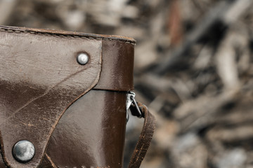 Ancient Retro film camera in the holster