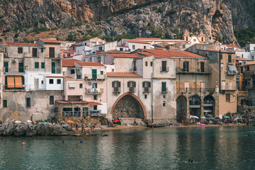 Cefalù, Sicily, Italy - August 22, 2019. The old buildings on the sea of Cefalù, an old fishing Sicilian village