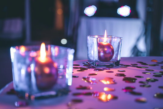 Details of a candle on the restaurant table, bokeh of light