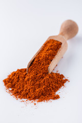 aromatic spicy chili powder on a white background