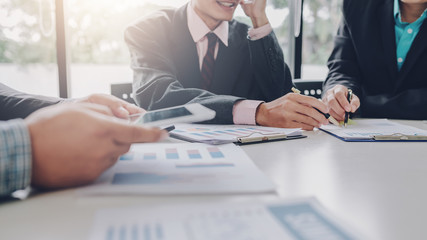 Investor group analyze information report financial graph at the meeting.