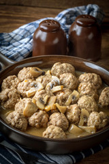 Delicious homemade swedish meatballs with mushroom cream sauce. Small depth of field.