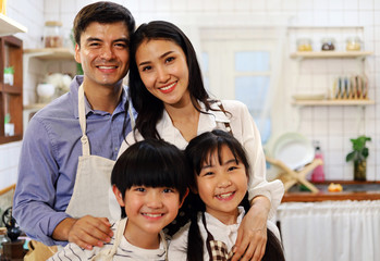 Obraz premium Happiness family smile portrait in kitchen room.