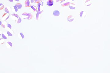 Pearl confetti on white background. Flat lay, top view.