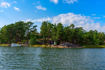 House and boat on the lake in the forest.