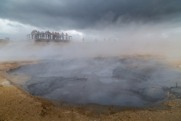 Hverir,Geothermal spot noted for its bubbling pools of mud & steaming fumaroles emitting sulfuric gas.