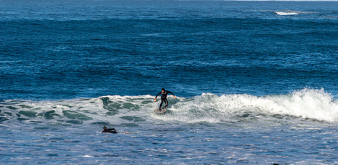 Sport surfing on the beach of zurriola located in san sebastian spain