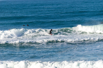 Sport surfing on the beach of zurriola located in san sebastian spain