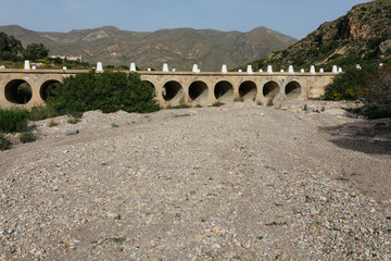 dried river bed due to illegal well on farms in Murcia region, Spain