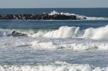 Sport surfing on the beach of zurriola located in san sebastian spain