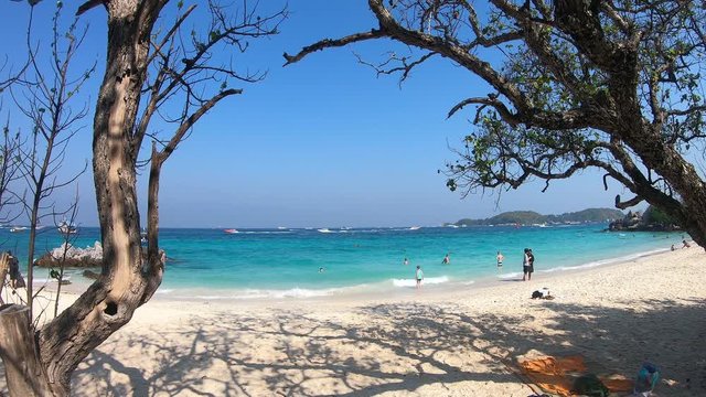 Happy holiday and tourist relax on the beach with seascape background in koh larn thailand. Summer vacation and tropical sea lifestyle.