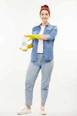 Pretty woman using several cleaning objects at the camera.