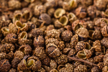 fragrant Sichuan pepper on white acrylic background