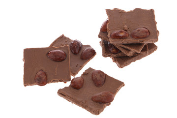 Dark chocolate pieces isolated on white background