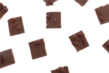 Dark chocolate pieces isolated on white background