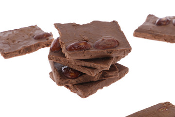 Dark chocolate pieces isolated on white background
