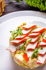 salad of fish sticks on dark wooden rustic background