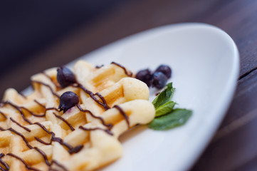 Belgian waffles with fresh berries and mint