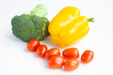Broccoli, yellow bell peppers and red cherry tomatoes