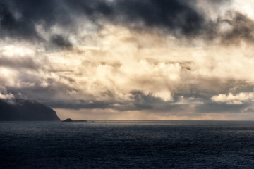KRAAKENES LIGHTHOUSE, NORWAY - 2015 NOVEMBER 15. Sea view from Kraakenes Lighthouse with dark clouds in the background.