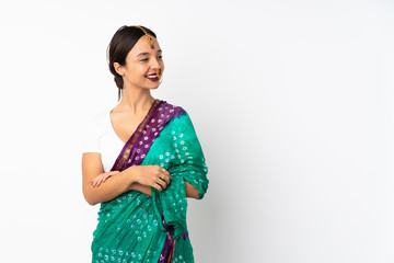 Young indian woman isolated on white background looking to the side