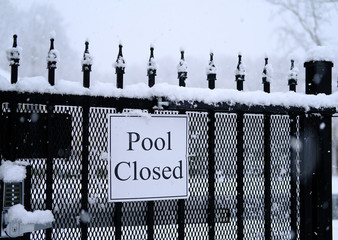 Sign on gate for Pool Closed in Snow