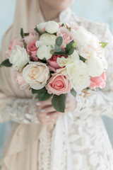 delicate wedding bouquet in the hands of the bride close-up