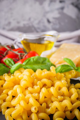 concept of traditional italian pasta with tomatoes and basil