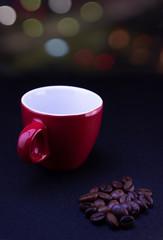 coffee red cup and coffee beans on bokeh background