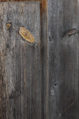 Old wood texture. Board of old natural wood with knots cracks and scuffs. Grey brown wooden vintage...