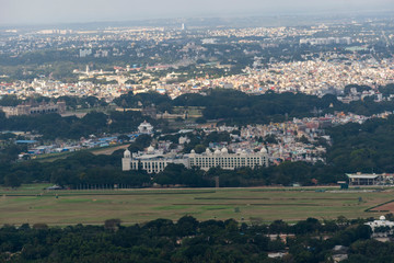 The view of the Mysore palace foggy sky over Mysore city taken on top of Chamundi Hills