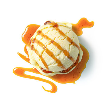 Vanilla ice cream ball with caramel syrup isolated on white background