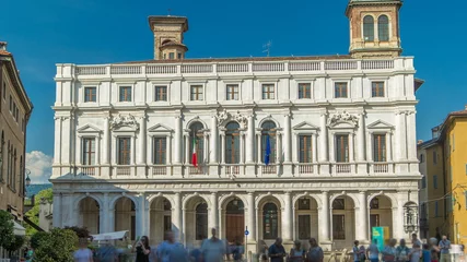 Fototapeten Main square piazza Vecchia in an Italian town Bergamo timelapse. Library and historic buildings. © neiezhmakov