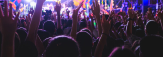 Abstract blurred background of Music concert any people. Crowd attending a concert.
